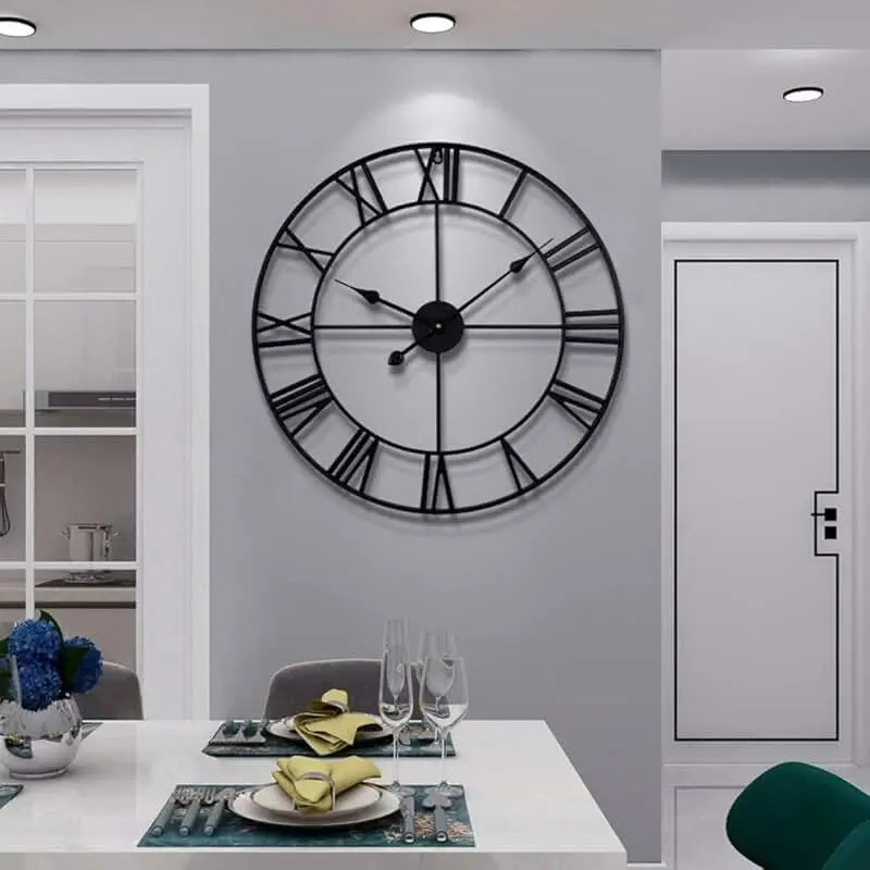 A bold, metallic clock with a futuristic design.